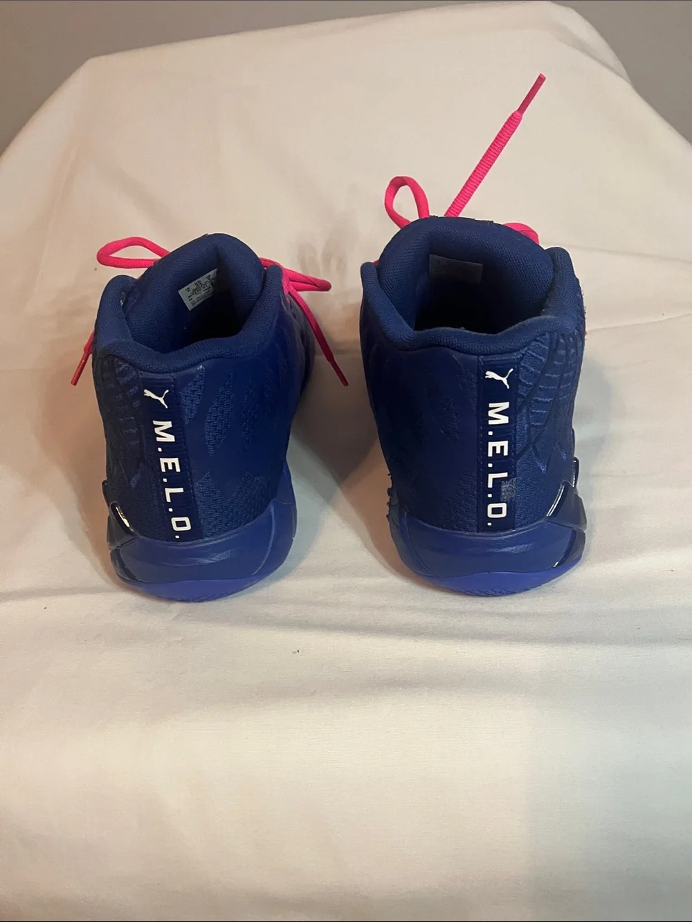 Puma mens Melo Athletic Shoes in Blue with Pink Laces